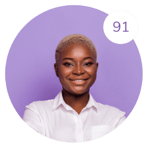 A person with short blonde hair and a white shirt smiles at the camera. Against the purple background, there's a white circle in the top right corner displaying the number 91, reminiscent of a high Wonderlic score.